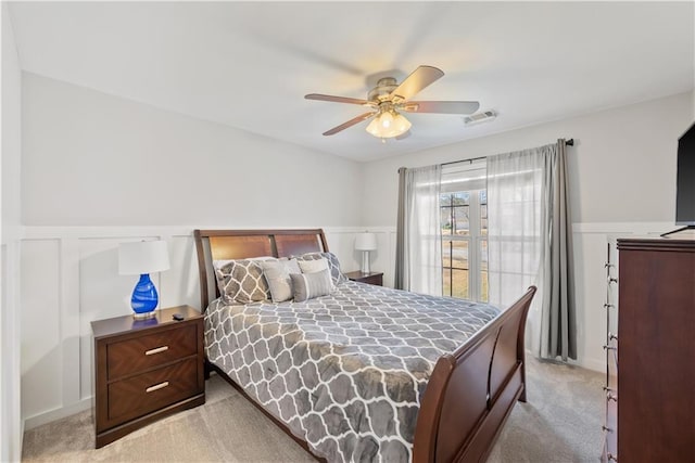 2995 Barimore, Dacula, GA 30019 - bedroom featuring light carpet, a wainscoted wall, ceiling fan, and a decorative wall