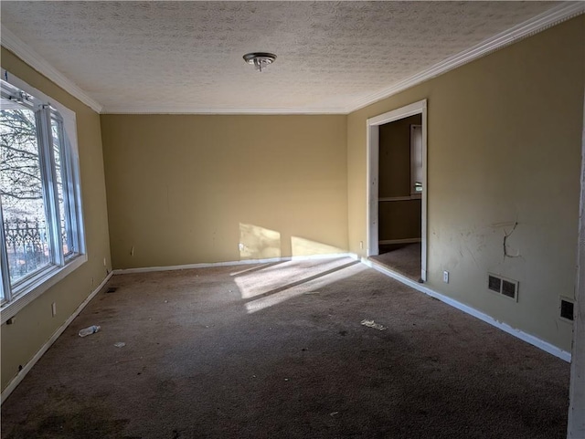 carpeted empty room featuring crown molding and a textured ceiling