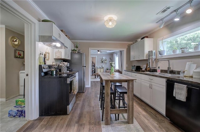 214 Iron St NW, Rome, GA 30165 - kitchen with dishwasher, range with electric stovetop, a sink, dark countertops, and ornamental molding