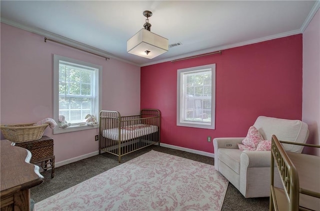 214 Iron St NW, Rome, GA 30165 - carpeted bedroom with multiple windows, crown molding, baseboards, and a crib