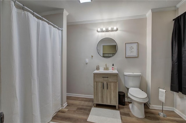 214 Iron St NW, Rome, GA 30165 - bathroom with toilet, ornamental molding, wood finished floors, vanity, and baseboards