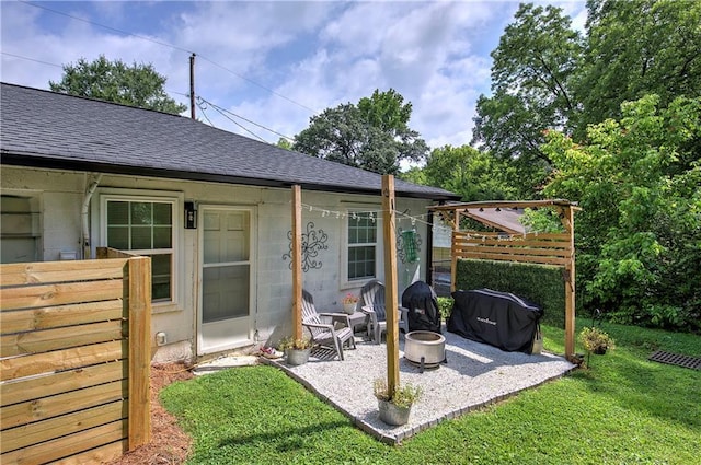 214 Iron St NW, Rome, GA 30165 - rear view of property featuring a shingled roof, a patio area, and a lawn
