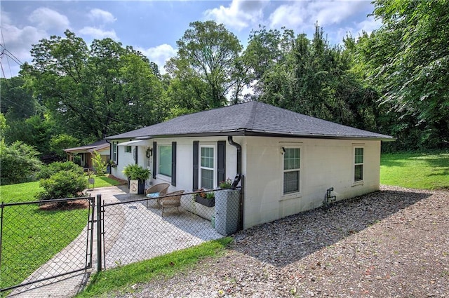 214 Iron St NW, Rome, GA 30165 - view of front facade featuring a shingled roof, a gate, and concrete block siding