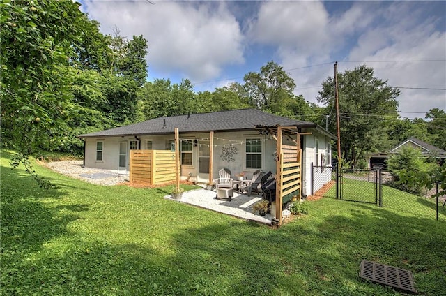 214 Iron St NW, Rome, GA 30165 - back of property featuring a gate, a patio, concrete block siding, and a shingled roof