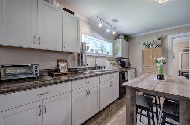 214 Iron St NW, Rome, GA 30165 - kitchen with a sink, dishwashing machine, dark wood-style floors, white cabinets, and crown molding