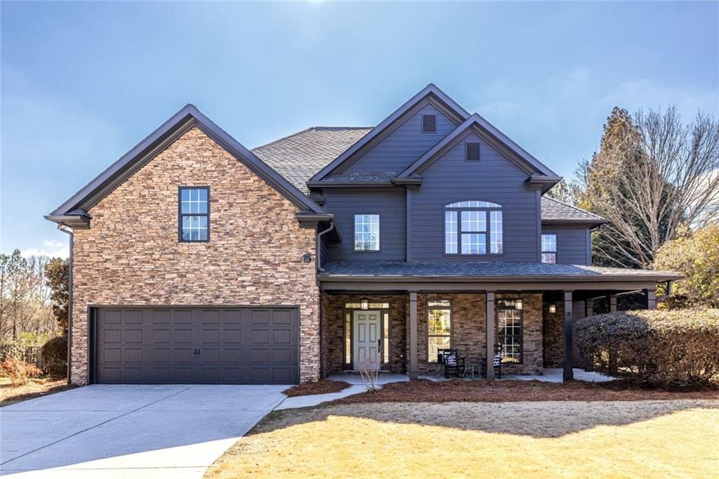 534 Mount Gerizim Rd SE, Mableton, GA 30126 - view of front of house with a garage, driveway, and a porch