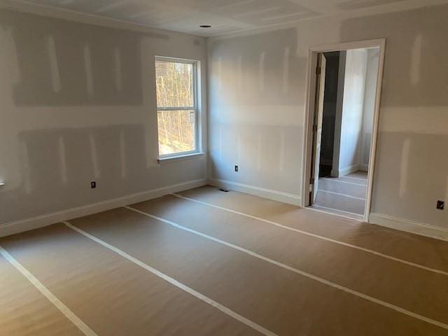 unfurnished bedroom featuring baseboards and wood finished floors