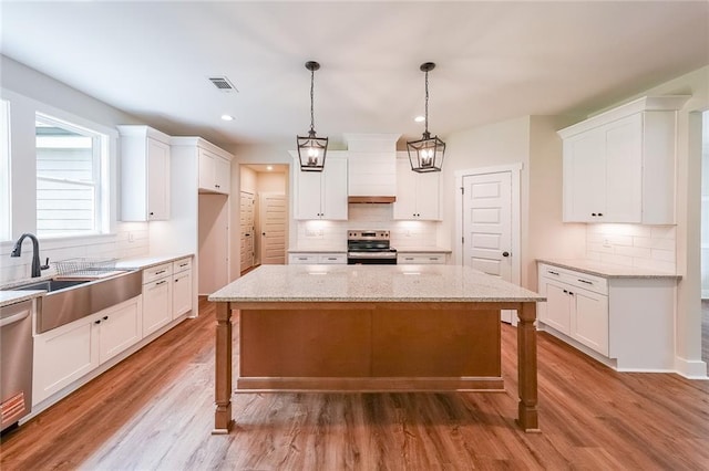 96 Lexie Ct, Rockmart, GA 30153 - kitchen with stainless steel appliances, backsplash, white cabinets, and recessed lighting