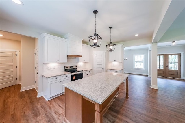 96 Lexie Ct, Rockmart, GA 30153 - kitchen with electric stove, white cabinetry, backsplash, and recessed lighting