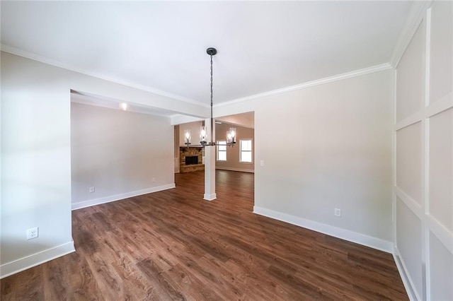 96 Lexie Ct, Rockmart, GA 30153 - unfurnished room with a chandelier, dark wood finished floors, and crown molding