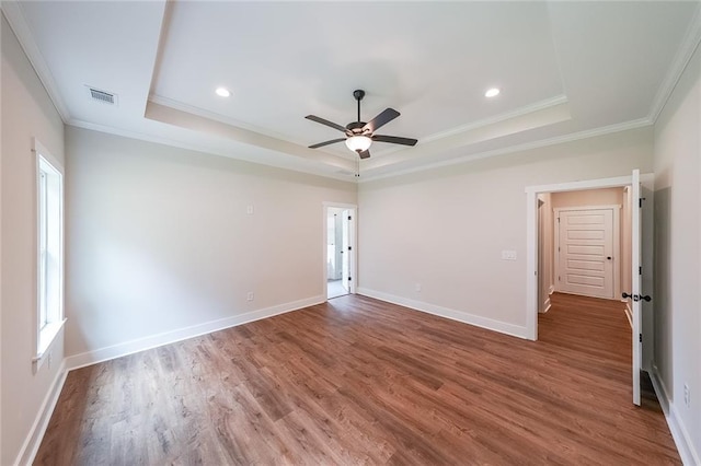 96 Lexie Ct, Rockmart, GA 30153 - unfurnished room with a raised ceiling, crown molding, wood finished floors, ceiling fan, and recessed lighting