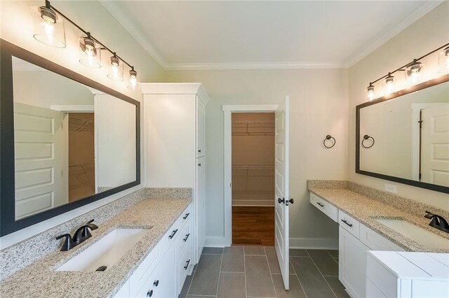 96 Lexie Ct, Rockmart, GA 30153 - bathroom with a spacious closet, two vanities, ornamental molding, and tile patterned flooring