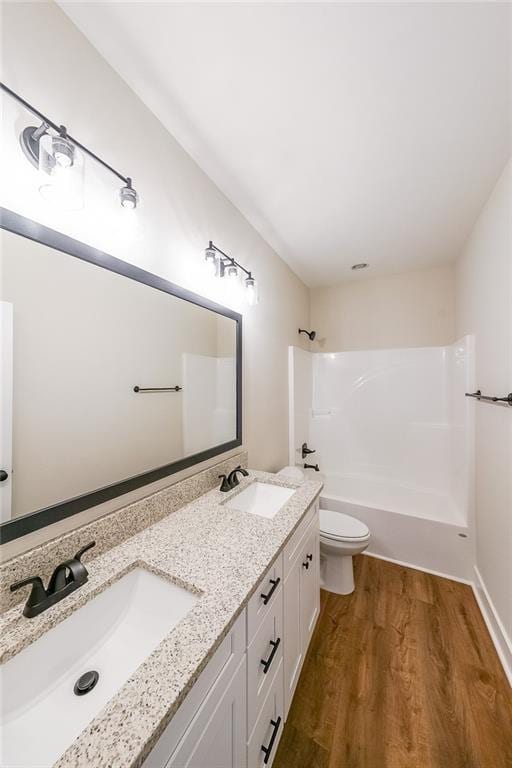 96 Lexie Ct, Rockmart, GA 30153 - full bathroom featuring wood finished floors, double vanity, and bathtub / shower combination