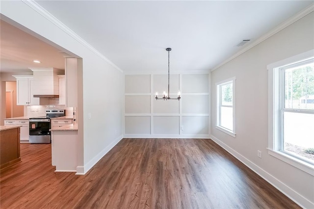 96 Lexie Ct, Rockmart, GA 30153 - unfurnished dining area with dark wood finished floors, a chandelier, healthy amount of natural light, and ornamental molding