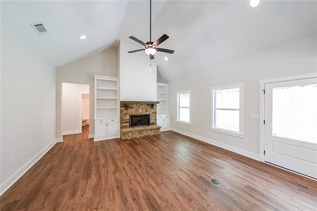 96 Lexie Ct, Rockmart, GA 30153 - unfurnished living room with built in shelves, a fireplace, ceiling fan, wood finished floors, and recessed lighting