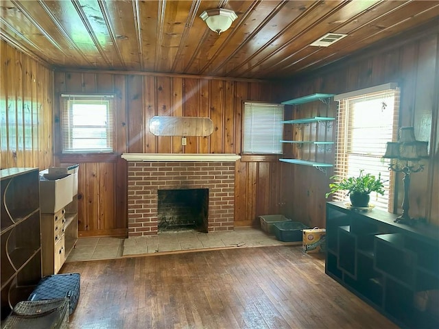 2115 Kings Rd, Dalton, GA 30720 - living area featuring wooden ceiling, wood walls, hardwood / wood-style floors, and a fireplace