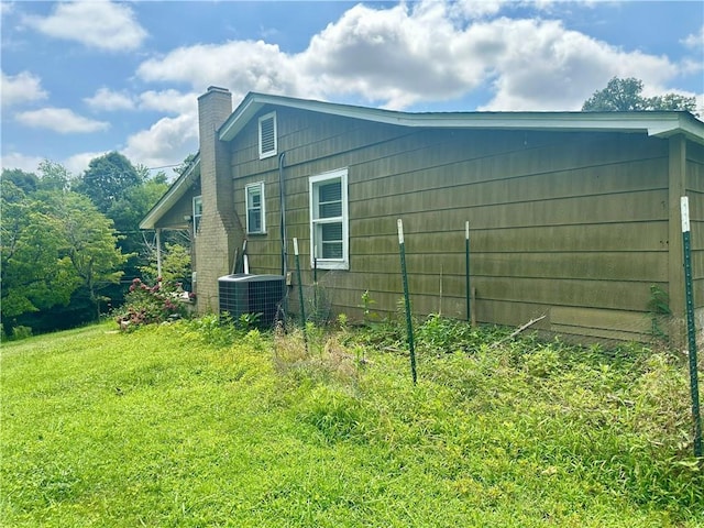 2115 Kings Rd, Dalton, GA 30720 - view of side of property featuring a central AC unit and a chimney