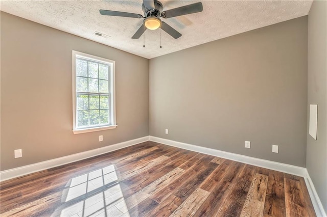 unfurnished room featuring ceiling fan, a textured ceiling, and dark hardwood / wood-style flooring