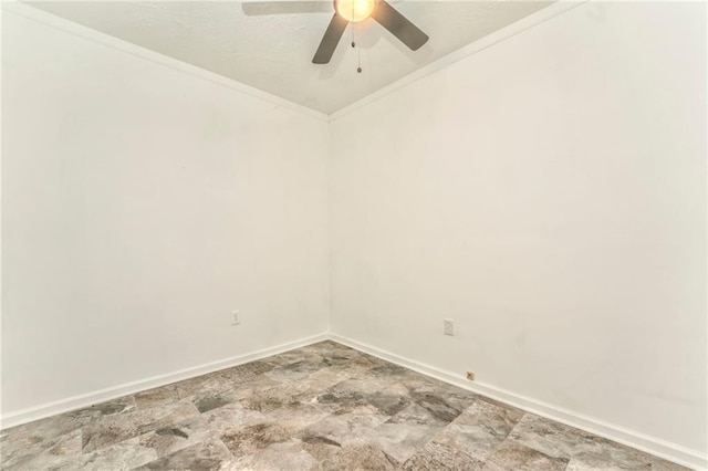 spare room featuring ceiling fan and ornamental molding