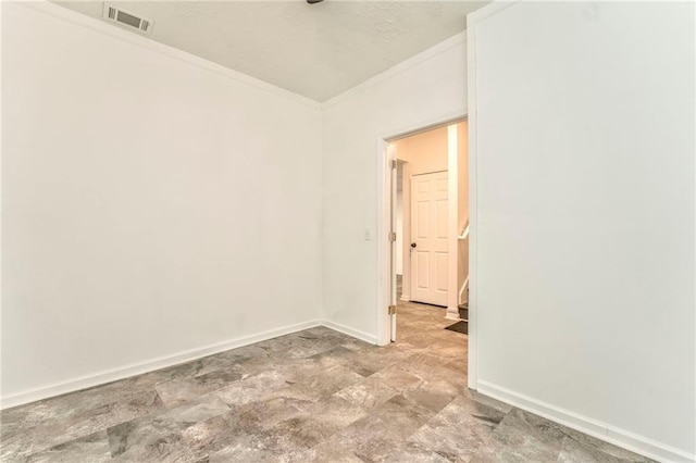 spare room with crown molding