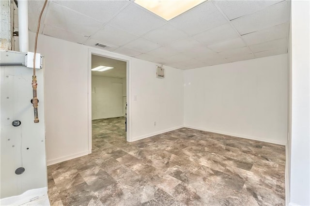 basement featuring a paneled ceiling