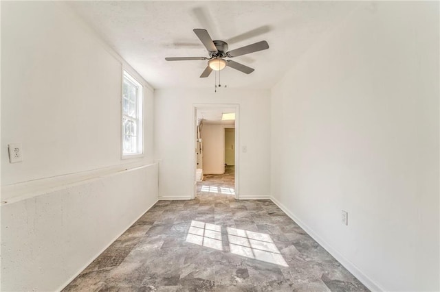 empty room featuring ceiling fan