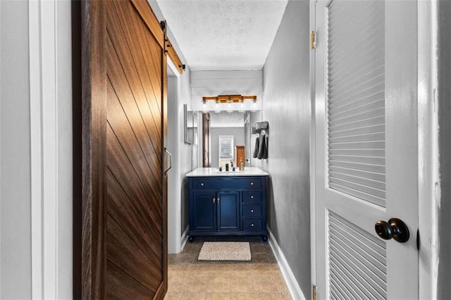 bathroom featuring vanity and a textured ceiling