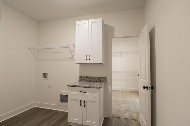 kitchen featuring a kitchen island, white cabinets, and high vaulted ceiling