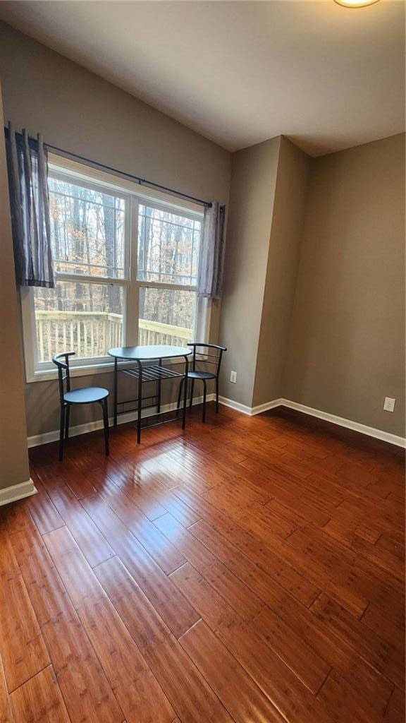 unfurnished room featuring hardwood / wood-style flooring