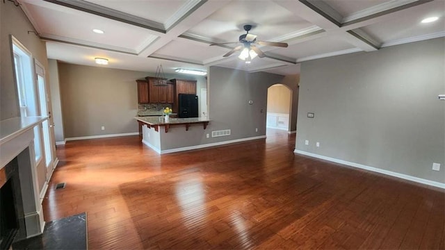 unfurnished living room with coffered ceiling, ceiling fan, a high end fireplace, and dark hardwood / wood-style floors