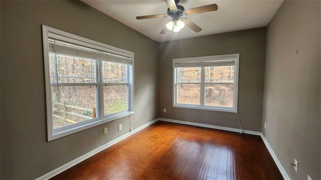 empty room featuring hardwood / wood-style flooring and ceiling fan