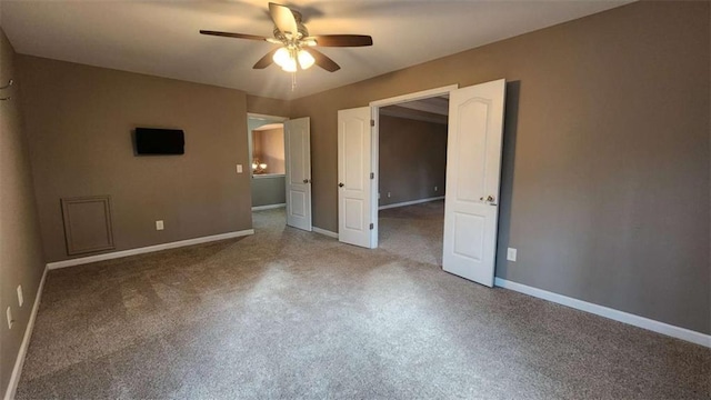 unfurnished bedroom featuring ceiling fan and carpet