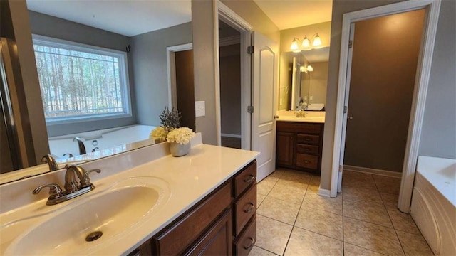 bathroom featuring vanity, a bathing tub, and tile patterned floors