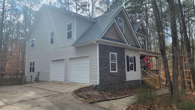 view of side of home with a garage