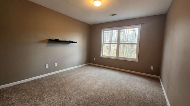 empty room featuring carpet floors