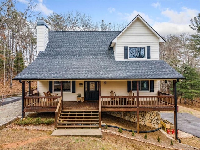 country-style home featuring a deck