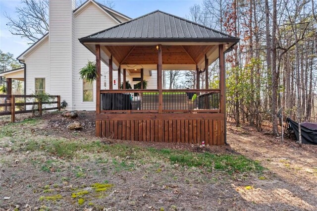 exterior space featuring a gazebo and fence