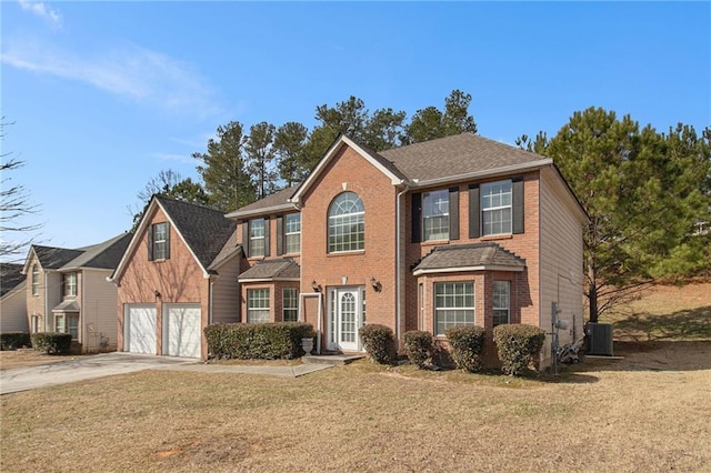 colonial-style house featuring central AC, concrete driveway, a front yard, a shingled roof, and brick siding