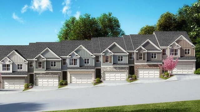 view of front of house with board and batten siding, driveway, and a garage