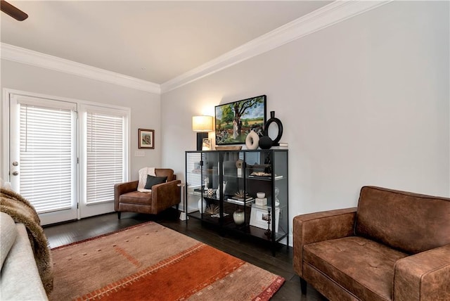 sitting room featuring crown molding and dark hardwood / wood-style floors