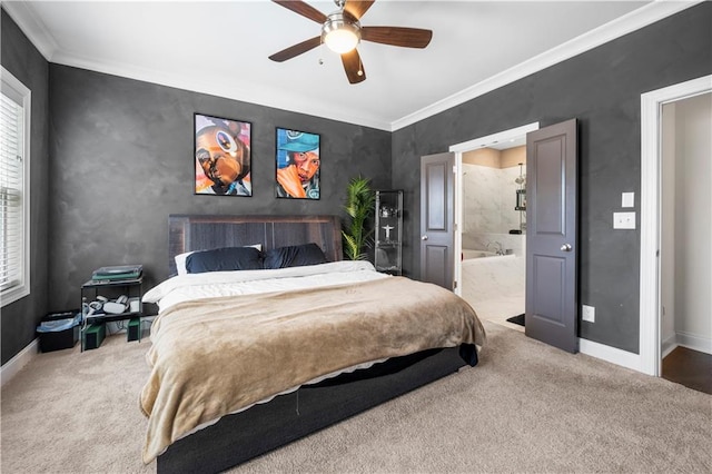 carpeted bedroom with ceiling fan, crown molding, and ensuite bath