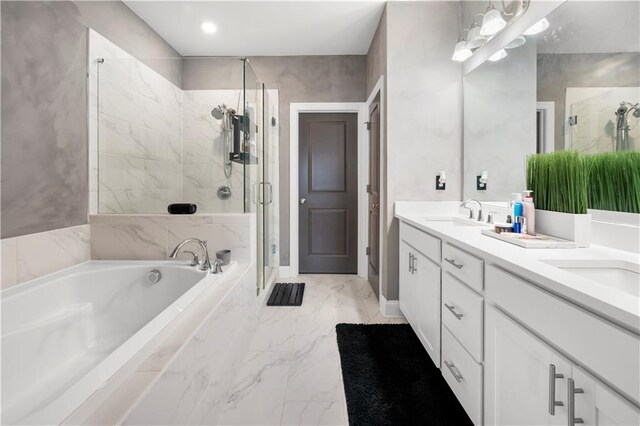 bathroom with vanity and independent shower and bath