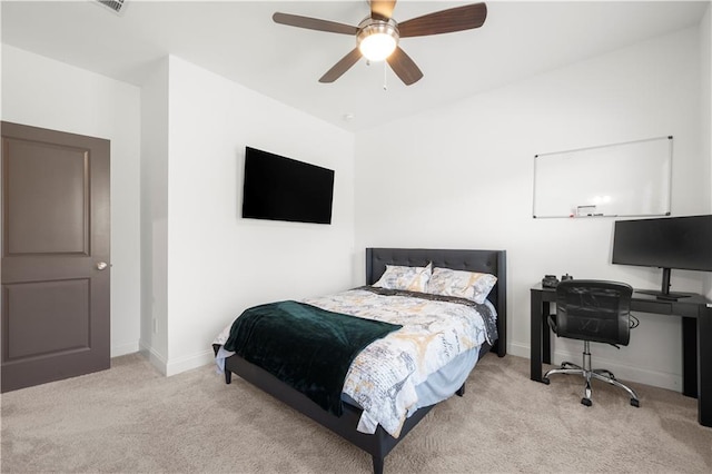 bedroom featuring ceiling fan and light carpet