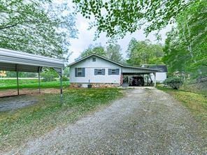 view of front facade with a carport