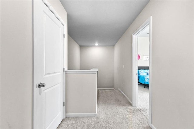 corridor with light colored carpet