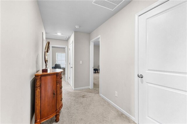 corridor with light colored carpet