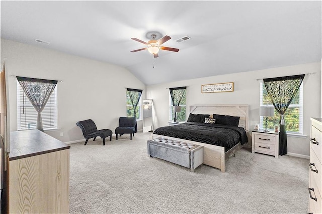 carpeted bedroom with ceiling fan and lofted ceiling