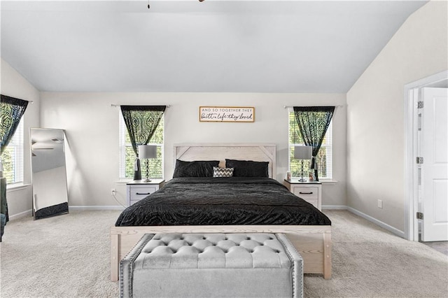 carpeted bedroom with vaulted ceiling