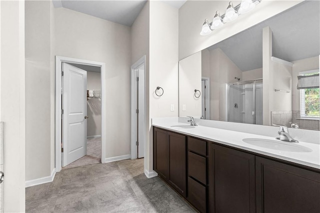 bathroom with vanity and a shower with shower door