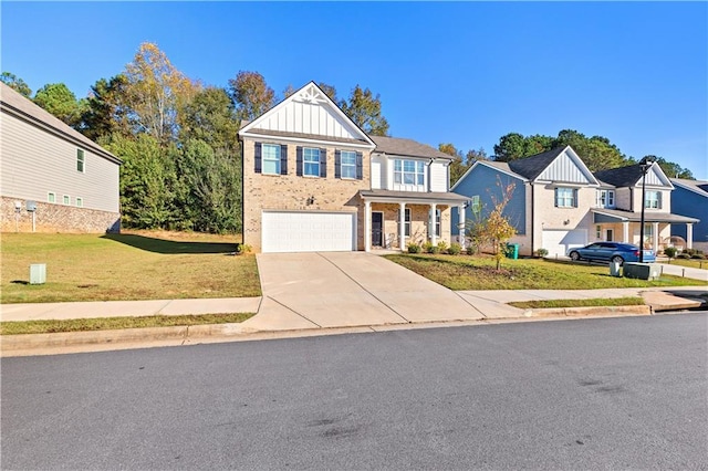 view of front of property featuring a front yard and a garage